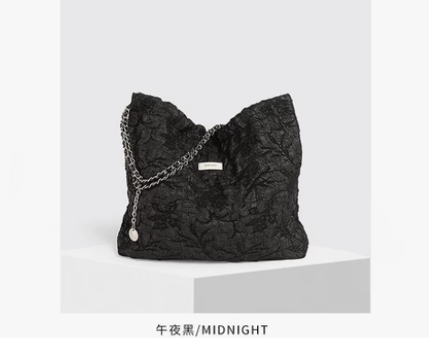 TOUTOU大容量通勤包 面料是泡泡提花工...