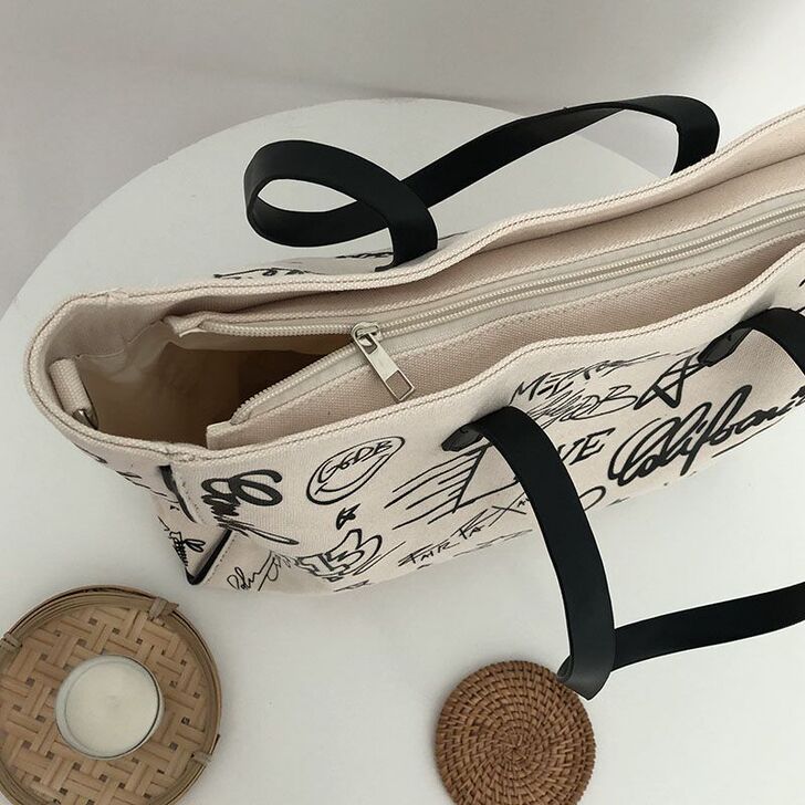 涂鸦帆布包包女2020新款大容量手提托特包...