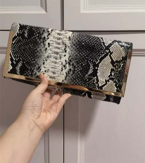 手拿包 英国品牌 女士 包 不记得什么牌子...