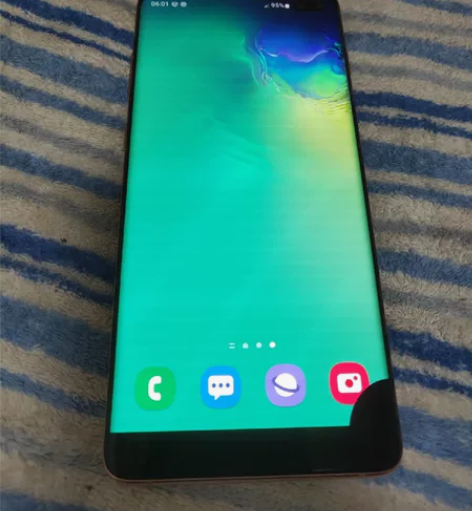 三星s10+屏下部漏液看图，盖板完美，红中...