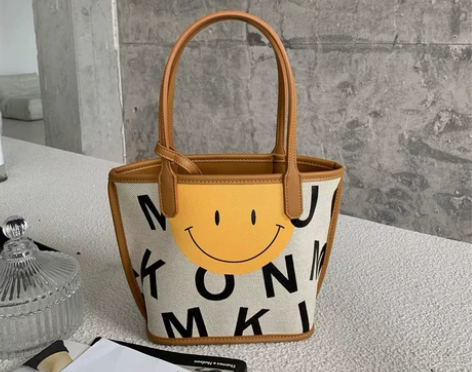 韩国东大门原创设计双面涂鸦笑脸字母帆布手提...