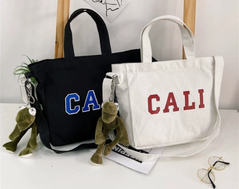 韩版大容量女士单肩帆布女包 个性字母印花帆...