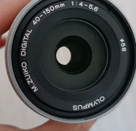 全新镜头，银色奥林巴斯40-150R。买了...