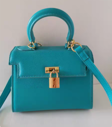 包邮蓝绿色凯莉同款包包，内里干净，使用不到...