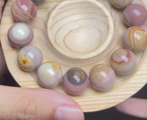 阿拉善焦糖幻彩14手串。甩卖 有几个珠珠小...