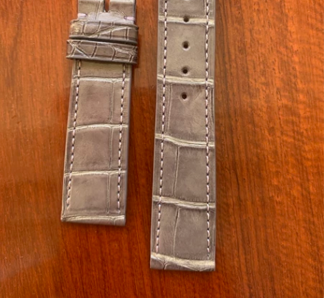 出一条万国原厂皮带，99新陈列表上换下来的...