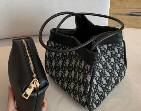 小红书超火搭配师小众设计黑白提花腋下包棍包...